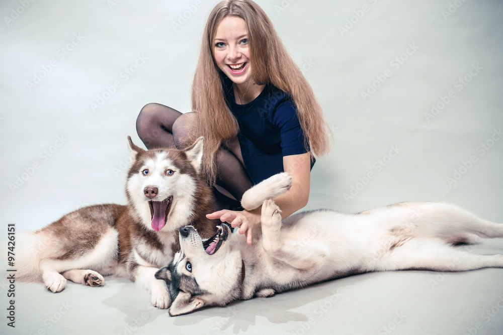 Girl with two dogs Siberian husky