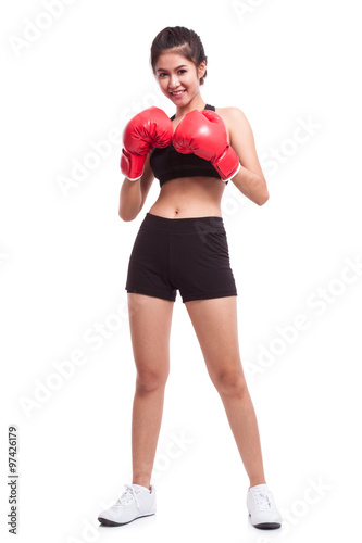 Boxer woman. Boxing fitness woman smiling happy wearing red boxing gloves on white background.