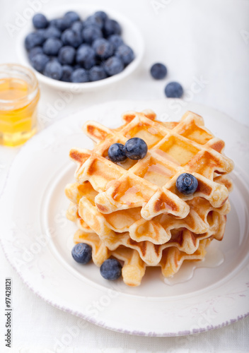 Fresh waffles with blueberries  maple syrup Breakfast table
