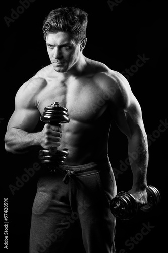 Sexy muscular fitness man. Black and white image.