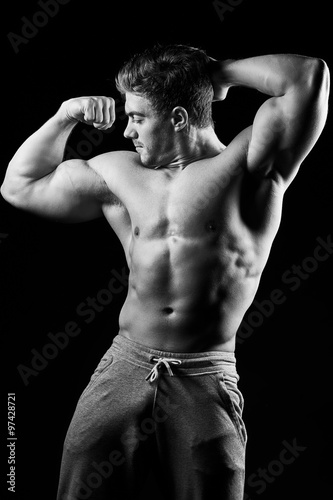 Sexy muscular fitness man. Black and white image.