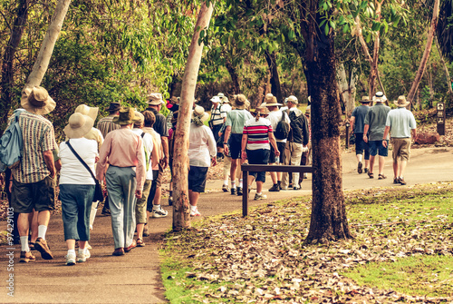 group of old and healthy people walking in the nature, vintage