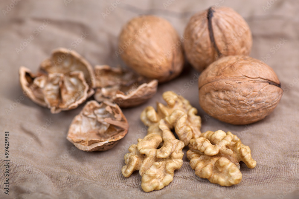Walnut without shell close-up, and nuts in the shell Walnut without shell close-up, and nuts in the shell