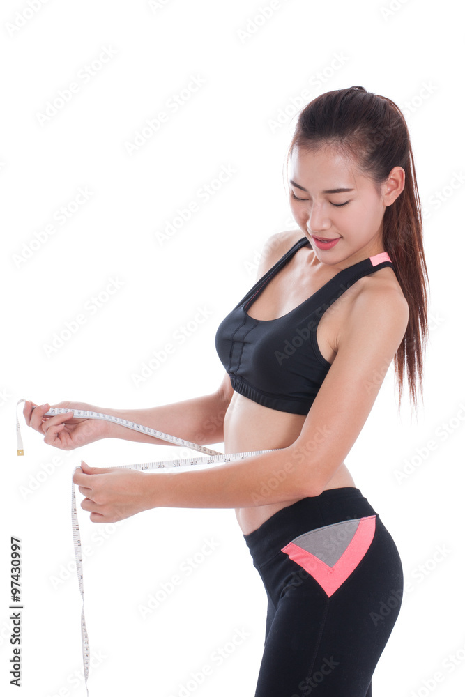 Fitness young woman taking measurements of her body. healthy concept Fitness young woman taking measurements of her body. healthy concept