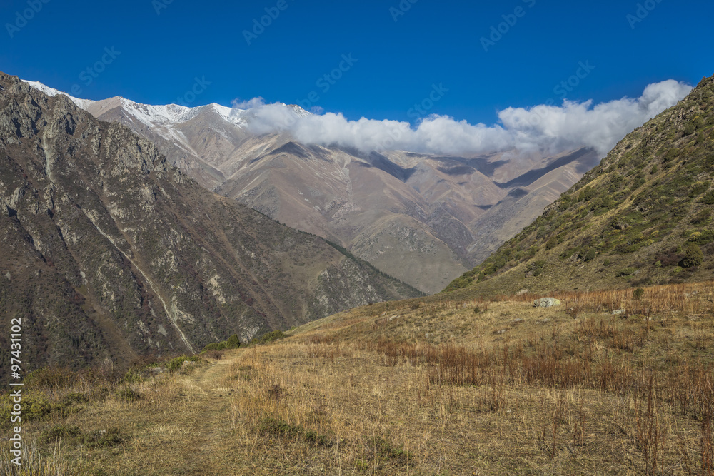 The panorama of mountain landscape of Ala-Archa gorge in the sum The panorama of mountain landscape of Ala-Archa gorge in the sum