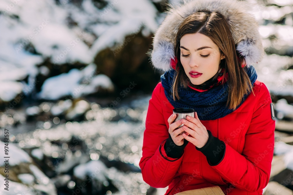 beautiful girl drinking from a thermos winter beautiful girl drinking from a thermos winter