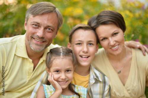 Family resting in summer park