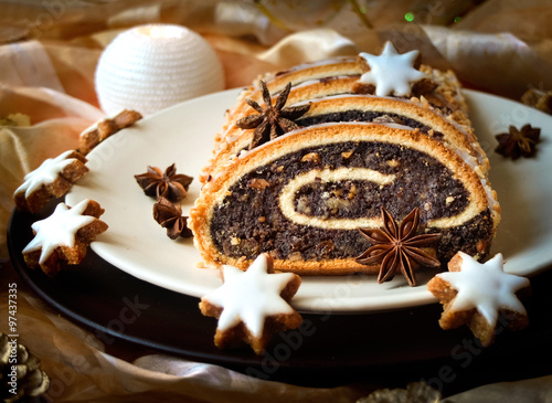 Christmas poppy seed cake on a plate with decoration