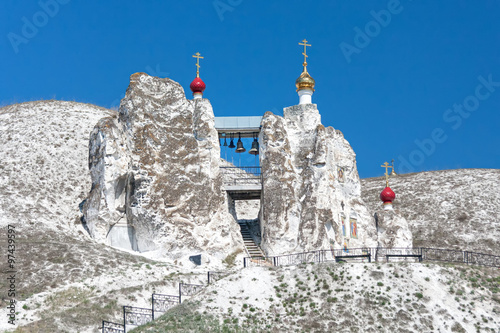The Holy Face cave cathedral of the Saviour nunnery against blue sky background. Kostomarovo village, Voronezhsky region, Russia.
