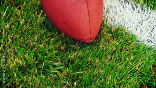 Football: Camera Slides Downfield And Stops At Ball photo