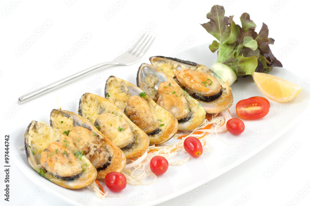 Grilled mussels with cheese and cherry tomatoes isolated on white Grilled mussels with cheese and cherry tomatoes isolated on white