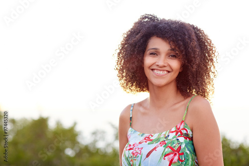 Beautiful mixed race woman smiling outdoors © mavoimages
