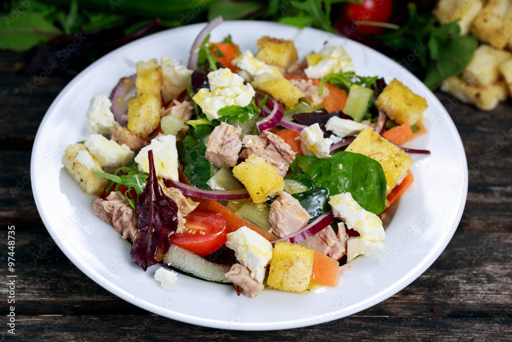 Close up Tuna salad with Spinach, rocket, red ruby chard, tomatoes, cucumbers, carrot, red onion, white chesse, croutons. Close up Tuna salad with Spinach, rocket, red ruby chard, tomatoes, cucumbers, carrot, red onion, white chesse, croutons.