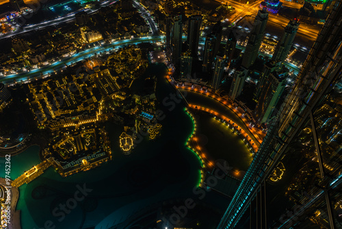 Dubai downtown night scene with city lights. Top view