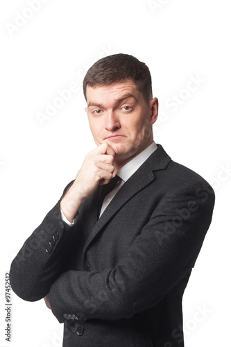 Businessman with hand on chin