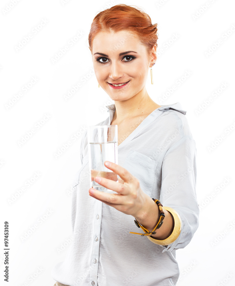 Happy young girl with a glass of water. A glass of water. Healthy life. Red-haired girl
