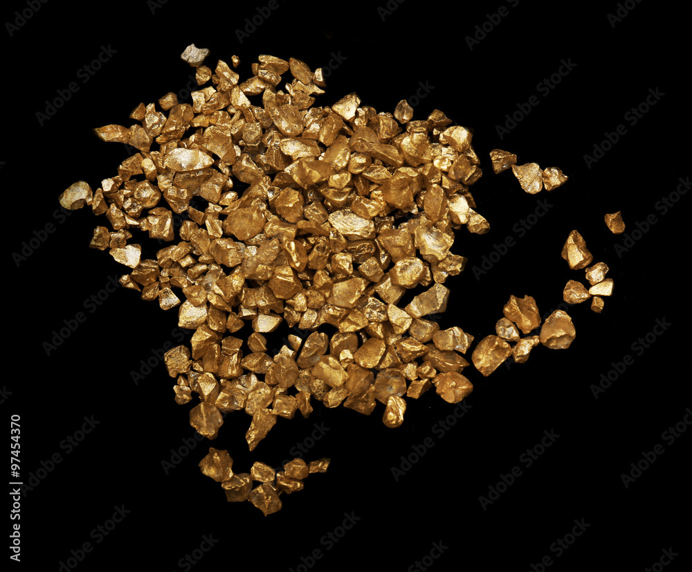 Scattered gold nugget grains, on black background Scattered gold nugget grains, on black background