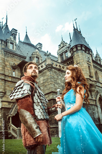 фотографія Beautiful princess is giving sword to her bravel knight. Ancient