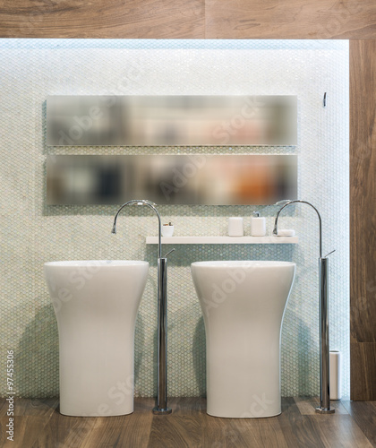 Washbasin and mirror in modern bathroom interior