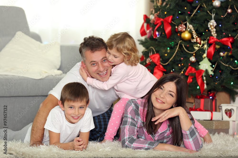 Christmas family portrait in home holiday living room, at morning Christmas family portrait in home holiday living room, at morning