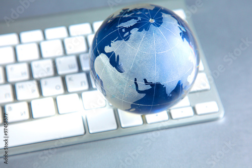 Cristal globe of the Earth on a Computer