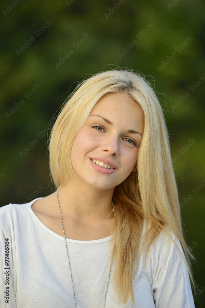 Portrait of beautiful blond girl with green background Portrait of beautiful blond girl with green background