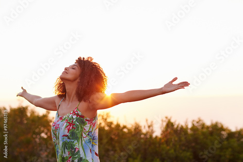 Canvas Print Woman with her arms outstretched in an expression of freedom