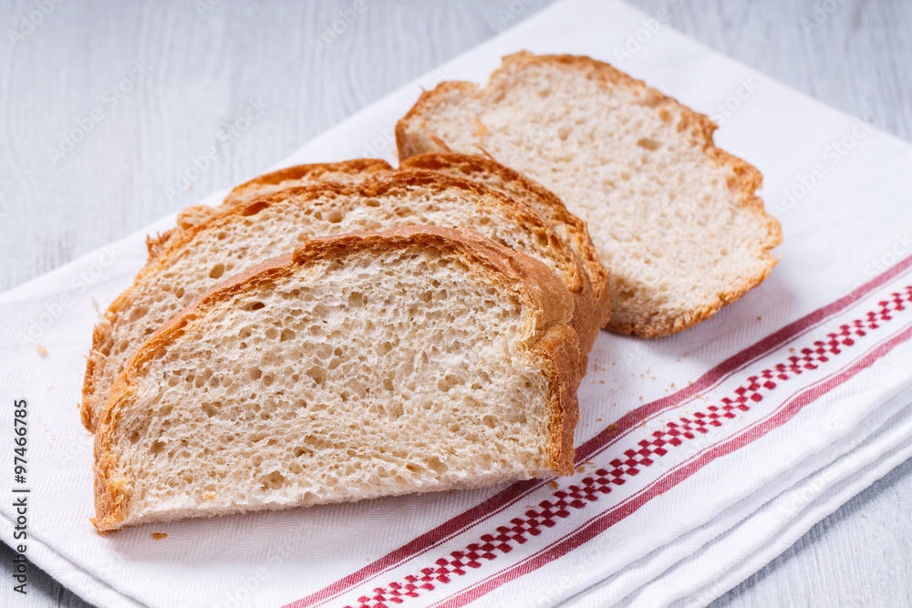loaf of white,wheat,fresh bread,homemade.Sliced loaf of bread.selective focus