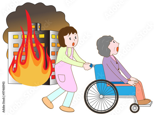 ビル火災で車いす老人と介護士が避難する