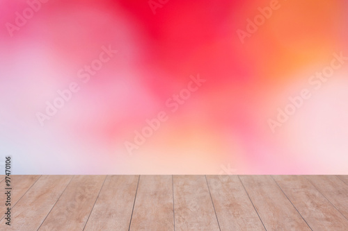 Wood table top on color abstract blurred background. ready for product display