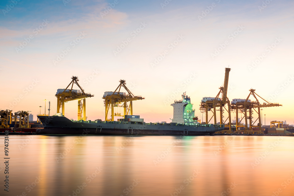 Fototapeta premium Container Cargo freight ship with working crane bridge in shipya