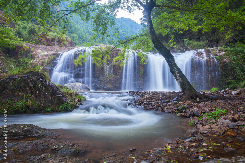 Obraz premium Natural waterfall in forest