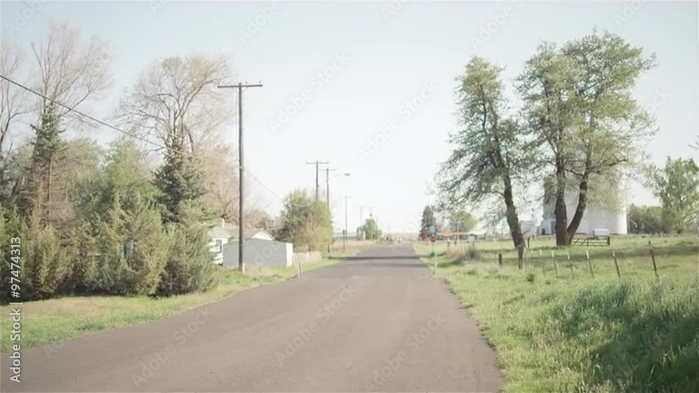 A paved road in an abandoned town A paved road in an abandoned town