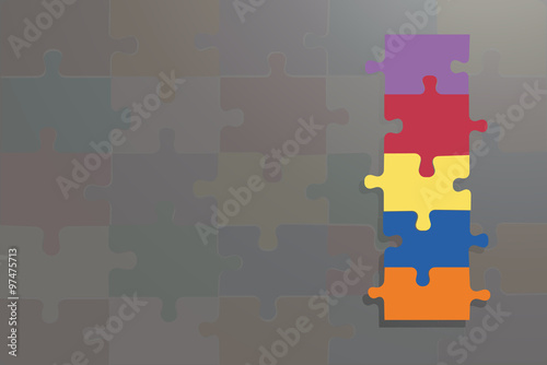 Four colorful puzzle pices on the grey background