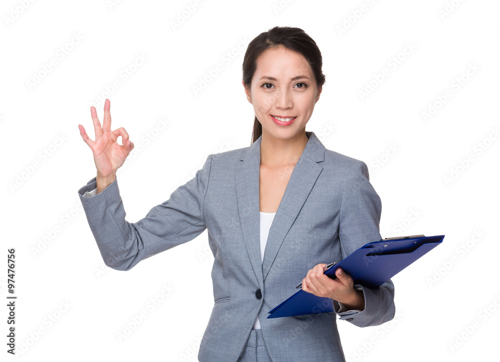 Businesswoman hold with clipboard and ok sign gesture Businesswoman hold with clipboard and ok sign gesture