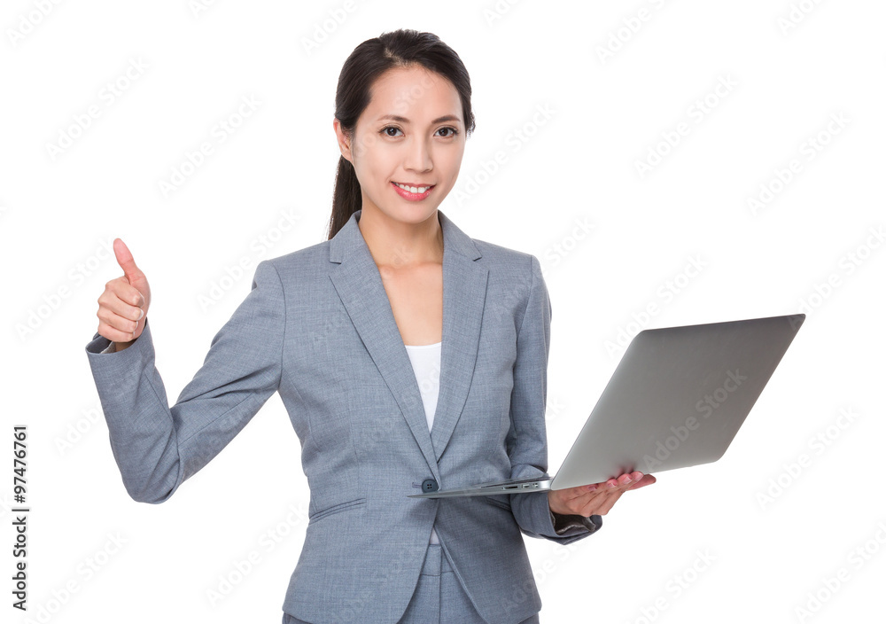 Asian Young Businesswoman use of the notebook computer and thumb Asian Young Businesswoman use of the notebook computer and thumb