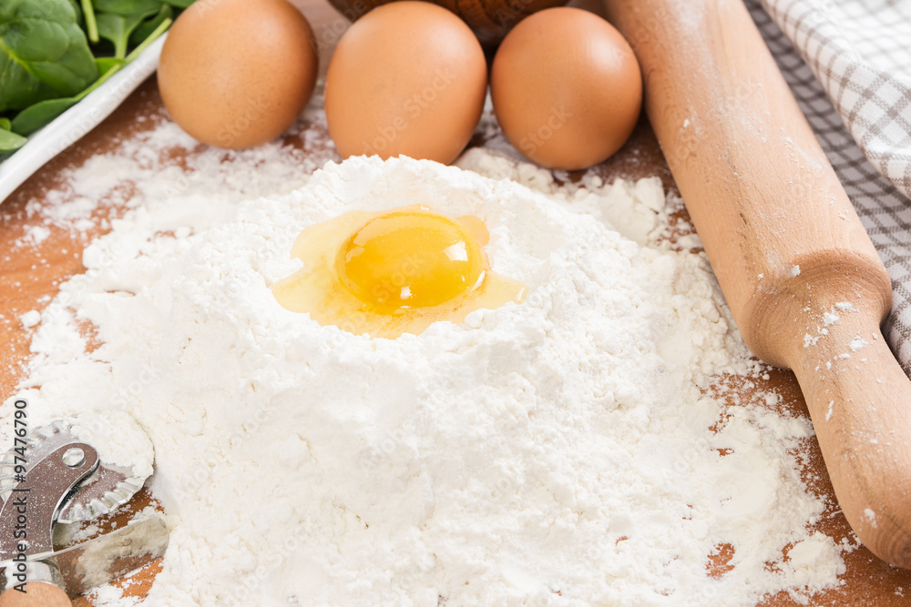 Ingredients for ravioli - flour, egg and spinach Ingredients for ravioli - flour, egg and spinach