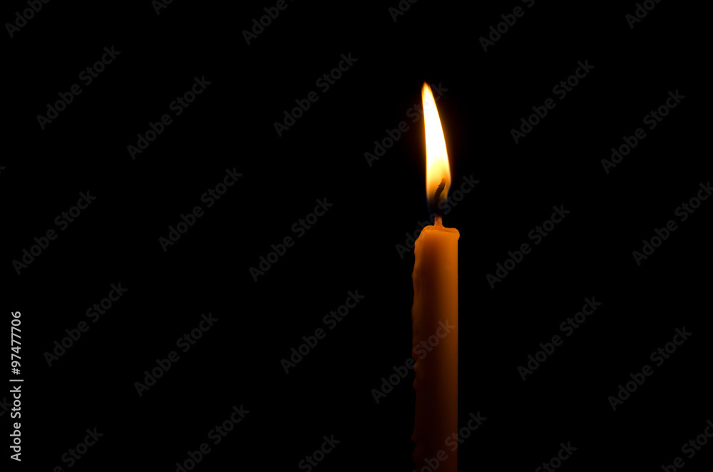 One frame light candle burning brightly in the black background One frame light candle burning brightly in the black background