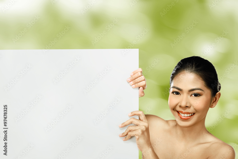 Pretty asian woman holding blank banner Pretty asian woman holding blank banner