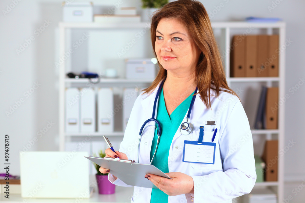 Portrait of happy medical doctor woman in office Portrait of happy medical doctor woman in office