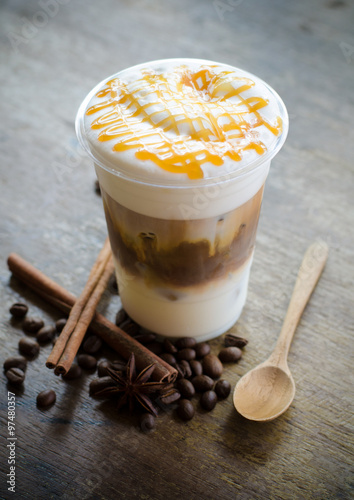 ice macchiato coffee on wooden table photo