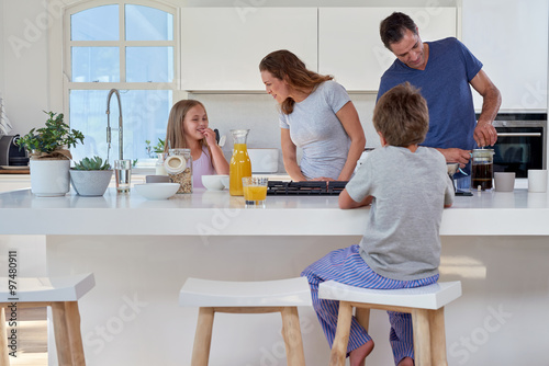 family in kitchen for breakfast