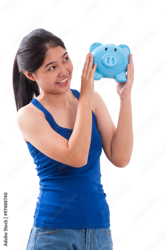 Happy young woman holding piggy bank isolated on white background Happy young woman holding piggy bank isolated on white background