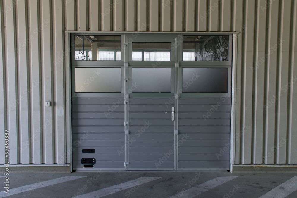 Rolltor mit extra Tür Stock-Foto | Adobe Stock