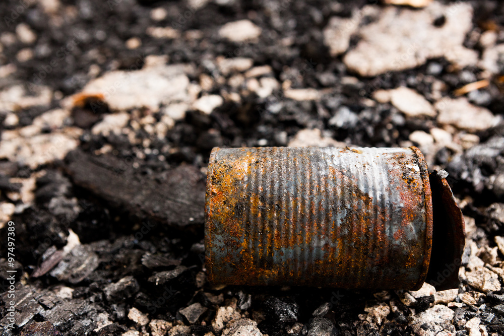 Obraz premium Tin can on burned ground