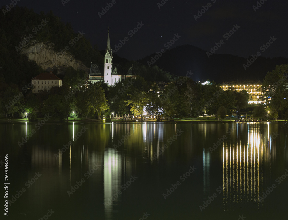 St. Martins Parish Church in the night on Bled lake