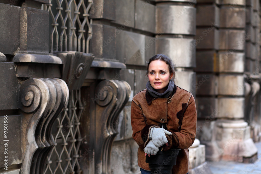 Beautiful woman wearing a suede jacket on the street Beautiful woman wearing a suede jacket on the street