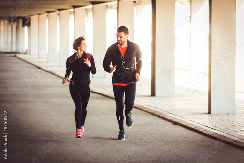Couple have conversation while running
