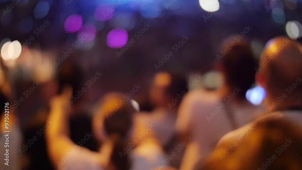 Handheld shot of a crowd making party at a rock concert. Slow motion Handheld shot of a crowd making party at a rock concert. Slow motion