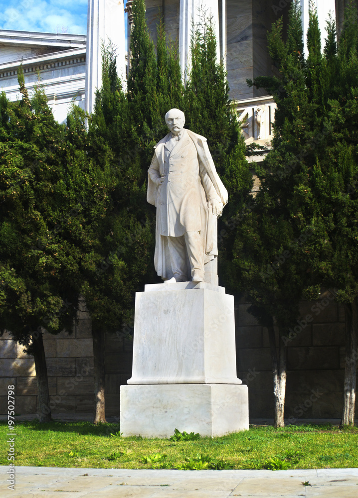 man statue in front of the national library of Athens Greece